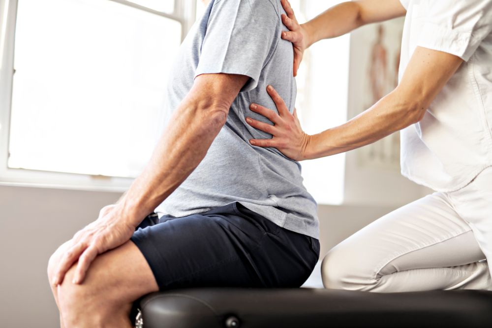 A Modern rehabilitation physiotherapy worker with senior client